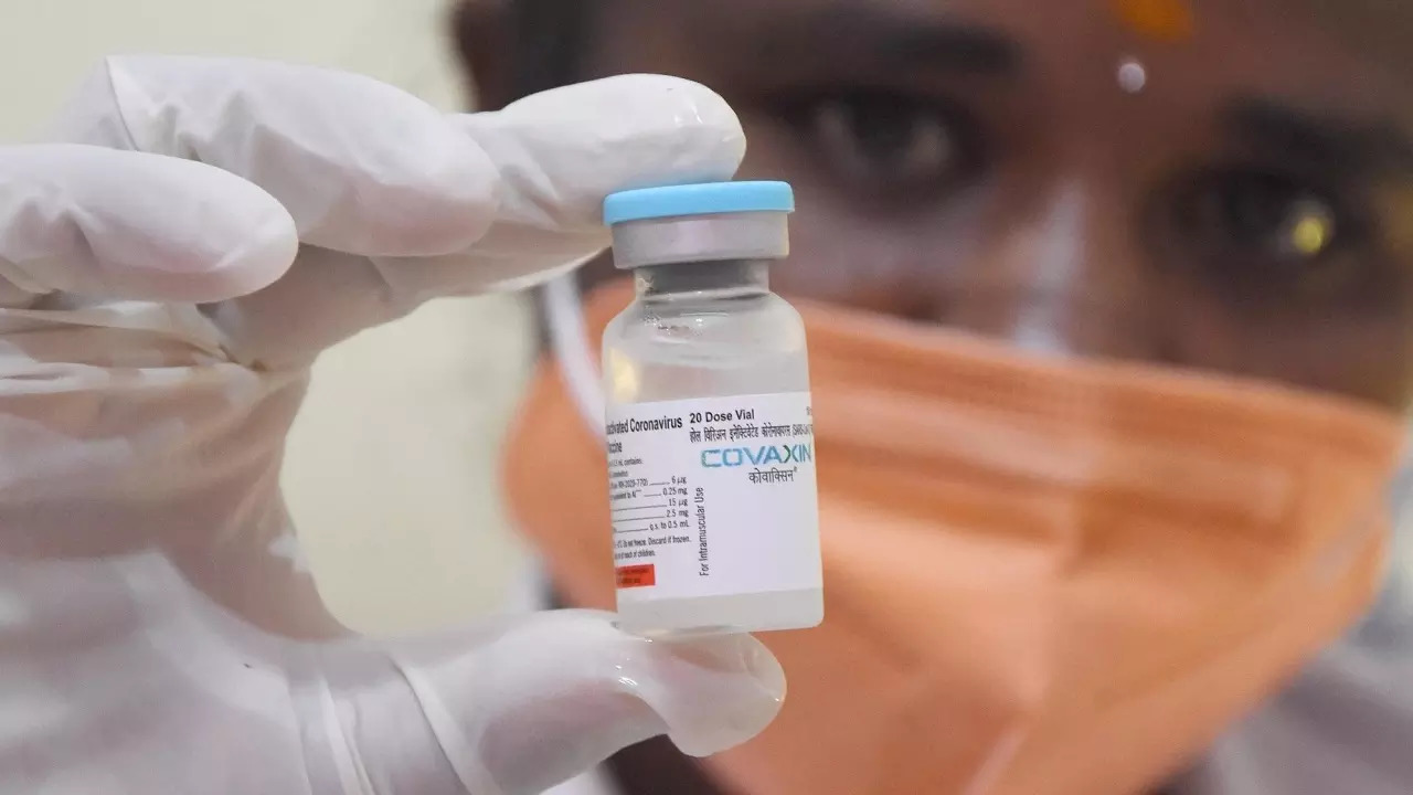 A health worker shows a vial of Covaxin dose of Covid-19 vaccine to administer to a beneficiary during a vaccination drive