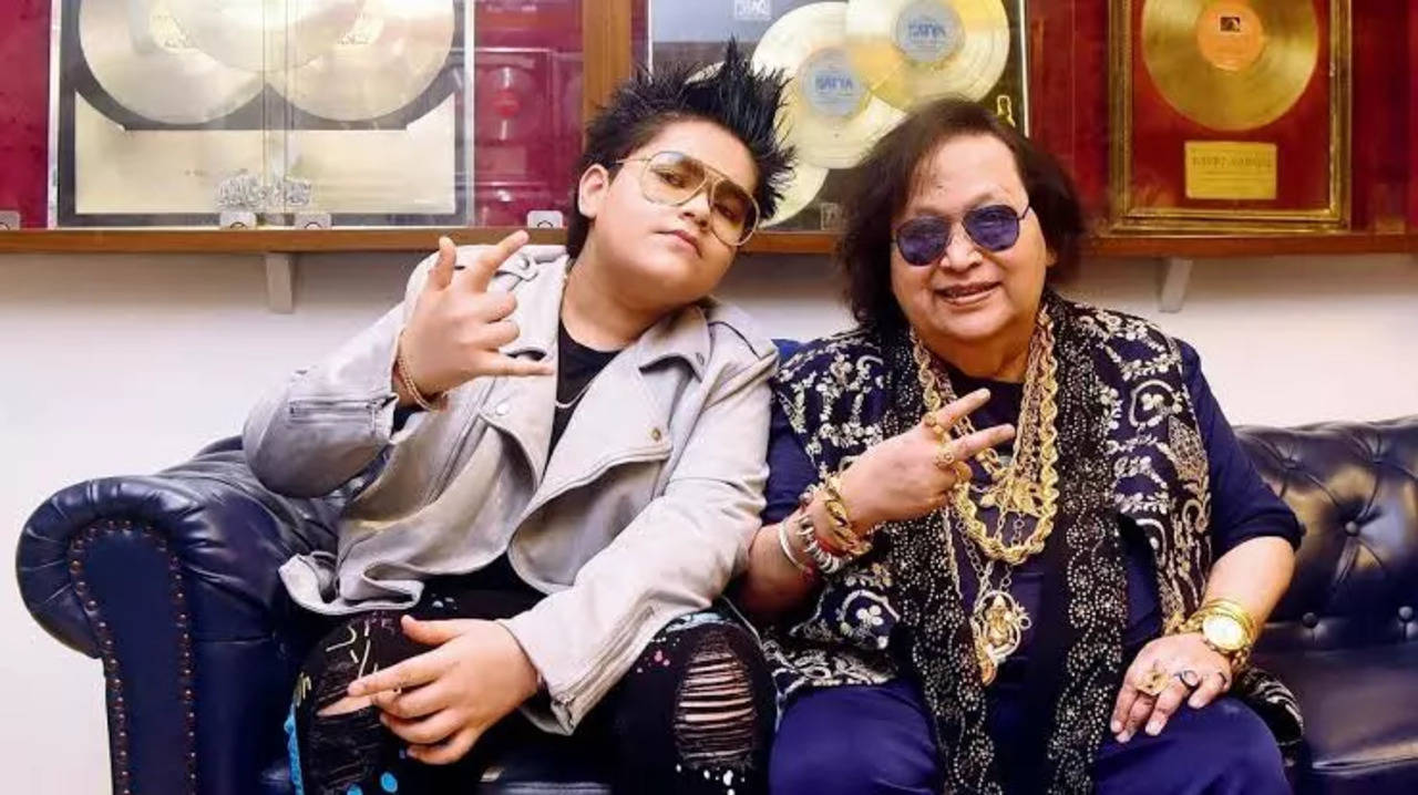 Rego B with his grandfather late Bappi Lahiri