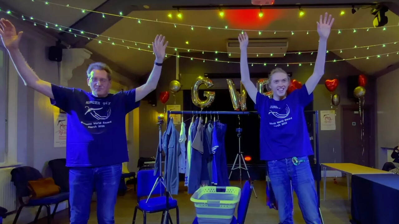 Guinness World Records British father and son hang 10 clothing items
