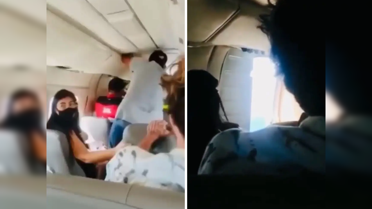 Passengers hold plane door after it opened mid-flight