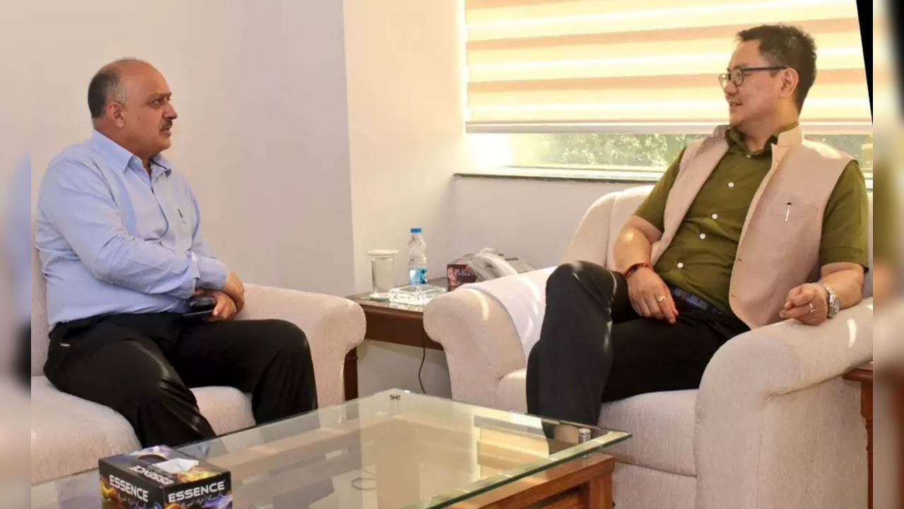 Senior IAS officer Naresh Kumar​ with Union Minister Kiren Rijiju in 2019​