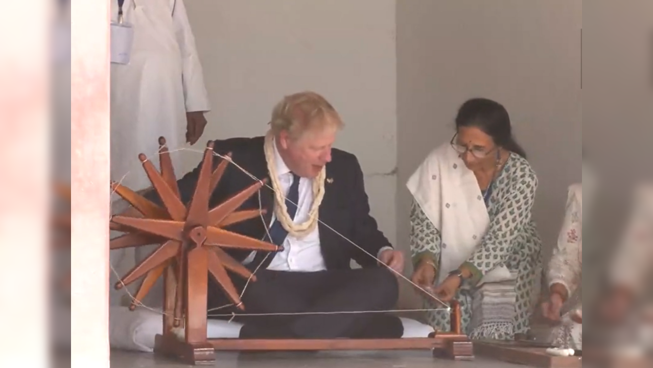 Boris Johnson tries the charkha at Sabarmati Ashram