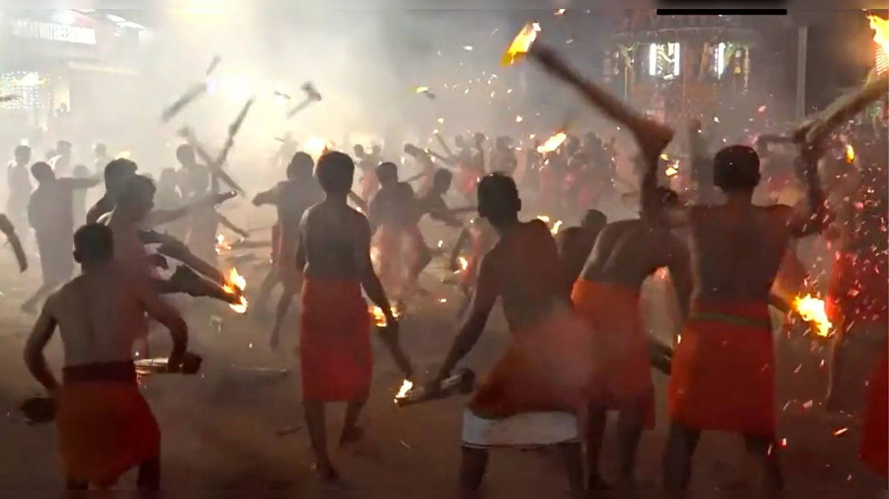 Two groups of bare-chested men engage in the Agni Kheli ritual that lasts for 15 minutes
