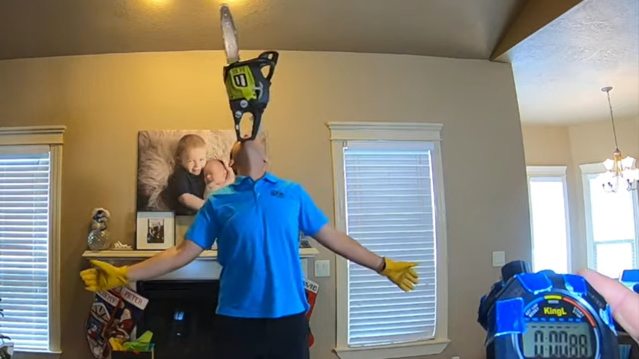 Man balances chainsaw on his chin for 37 mins, 56 secs