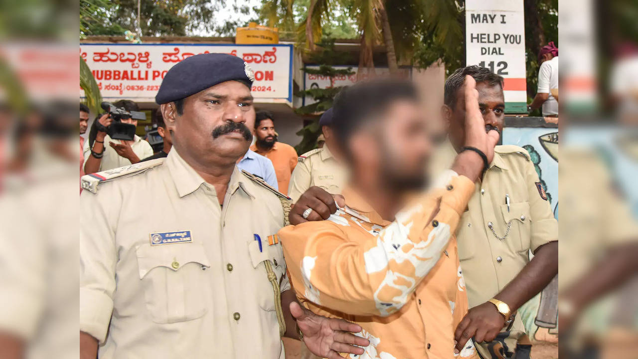 Hubballi: Police personnel detain accused allegedly involved in Hubballi violenc...