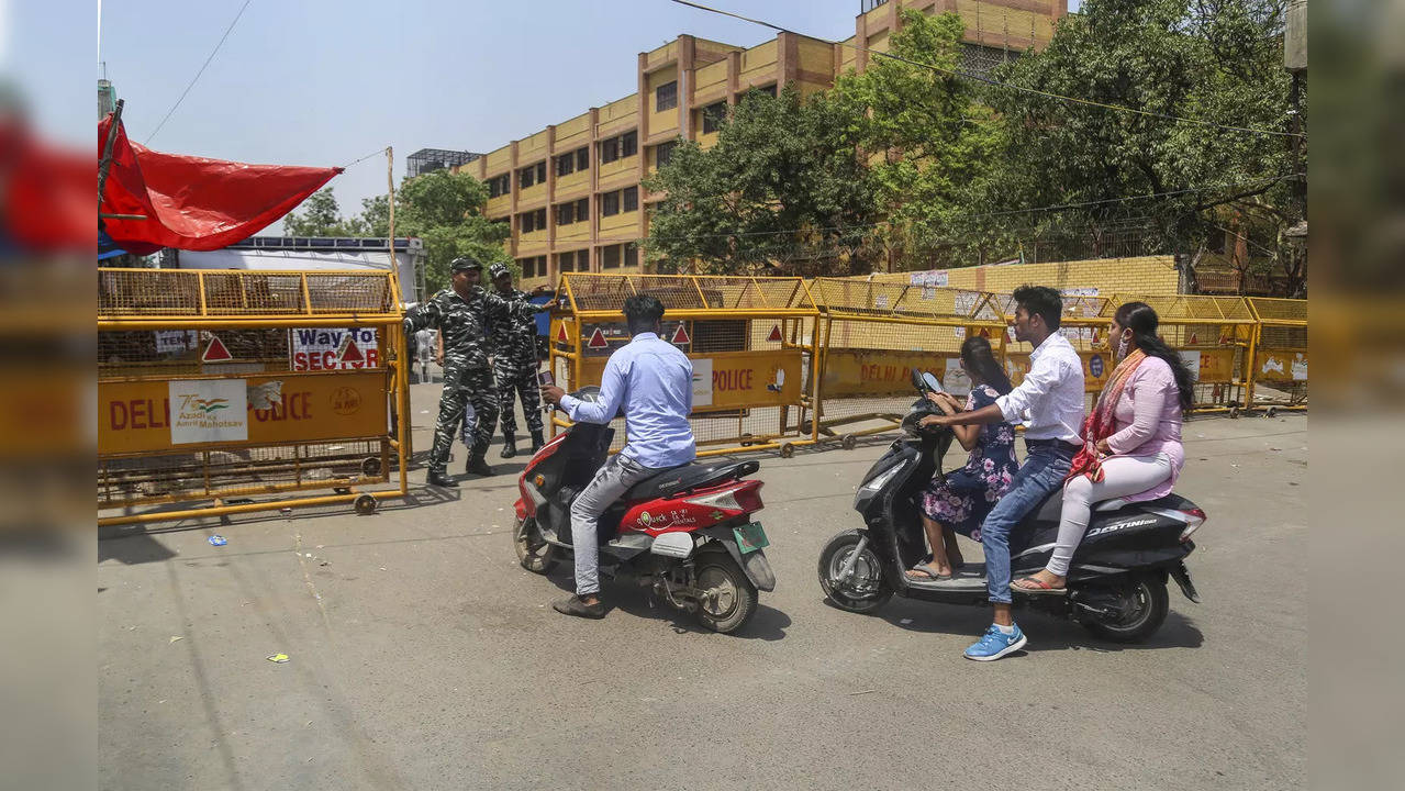 New Delhi: Security personnel stand guard in violence hit Jahangirpuri area, in ...