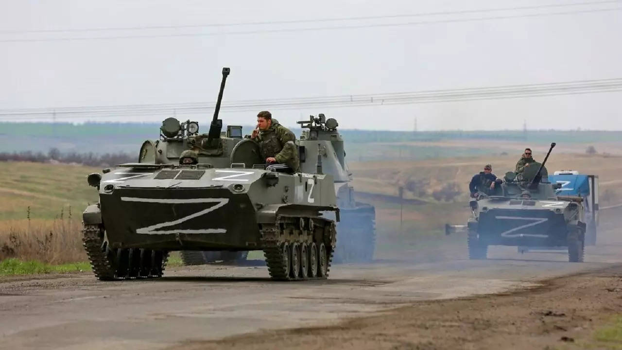 Russian military vehicles move on a highway in an area controlled by Russian-backed separatist forces near Mariupol