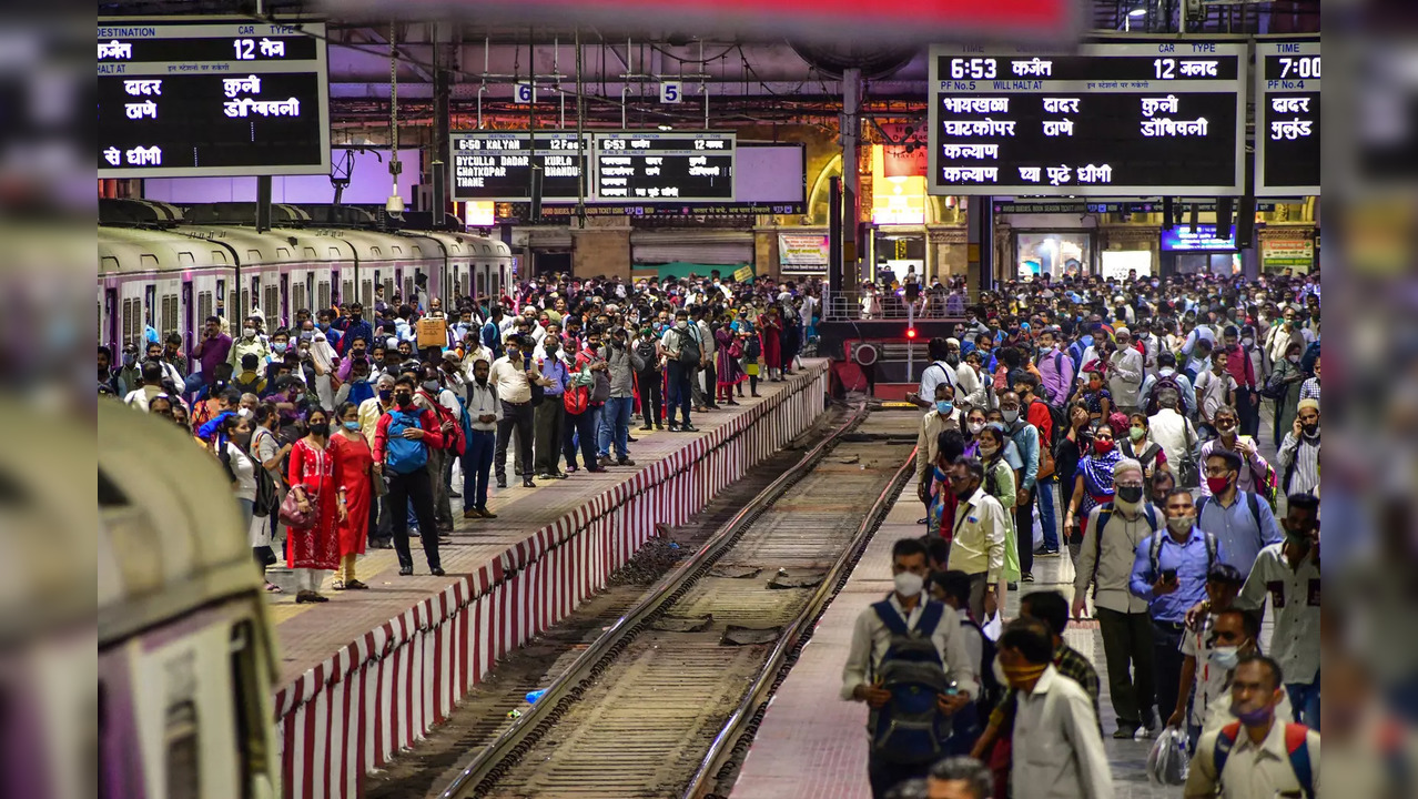 Mumbai: Commuters wait for their trains at platforms at the CSMT Station, in Mum...