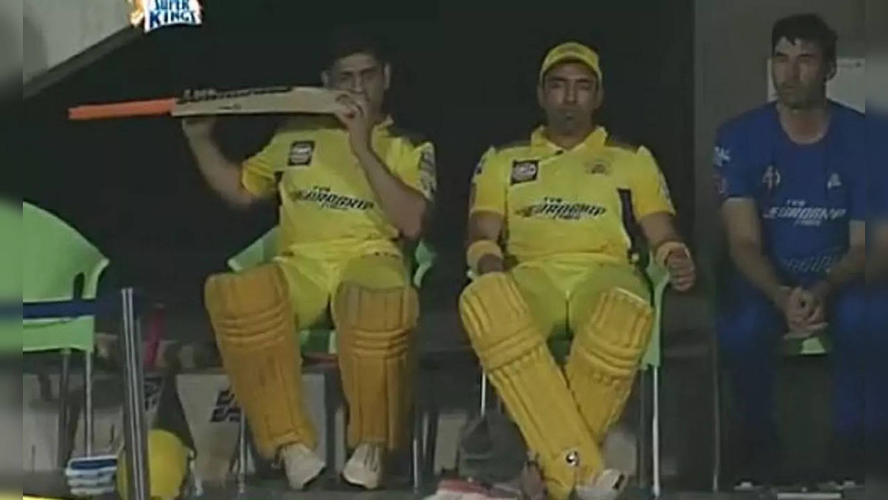 MS Dhoni eating his bat