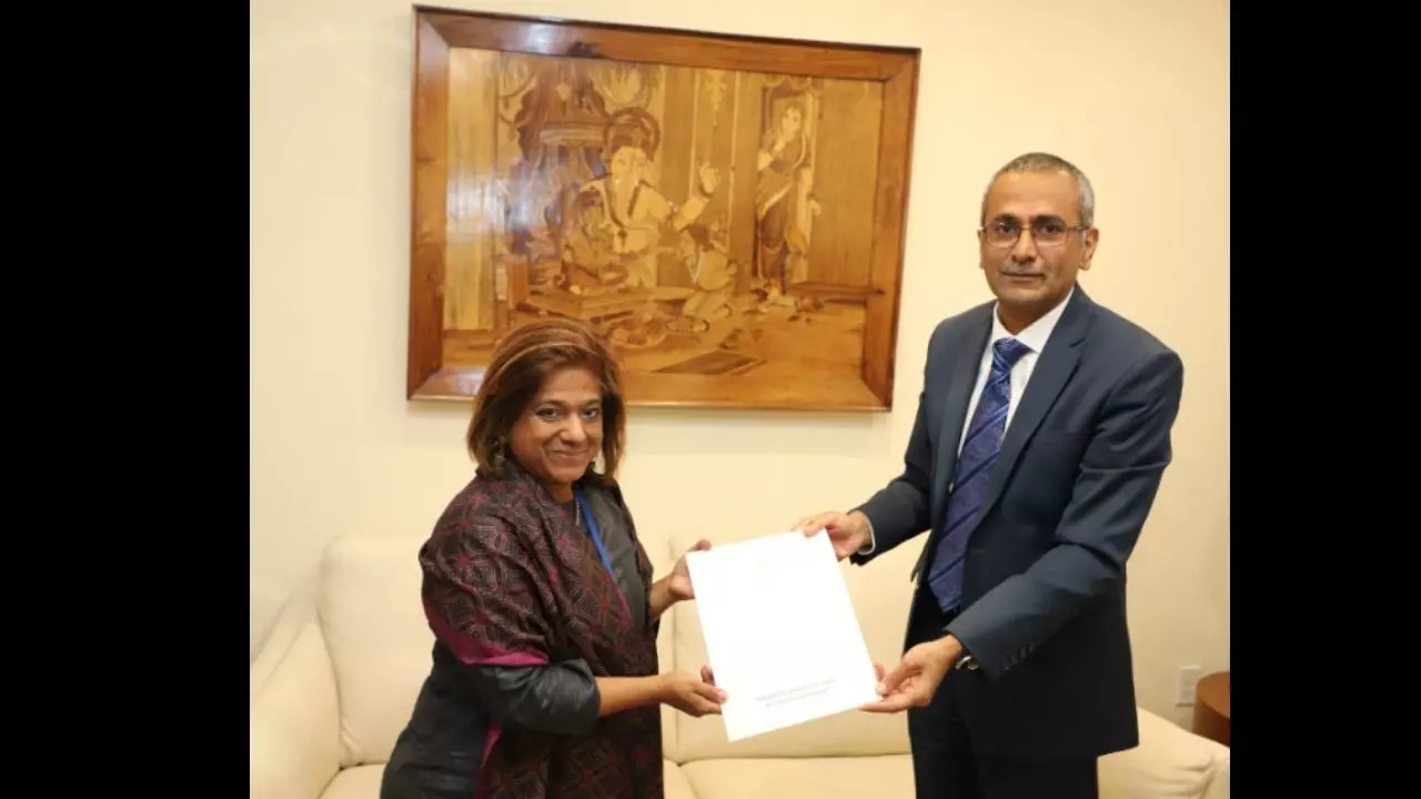 AmbDPR R. Ravindra handed over cheque for Hindi@UN project launched by India in 2018