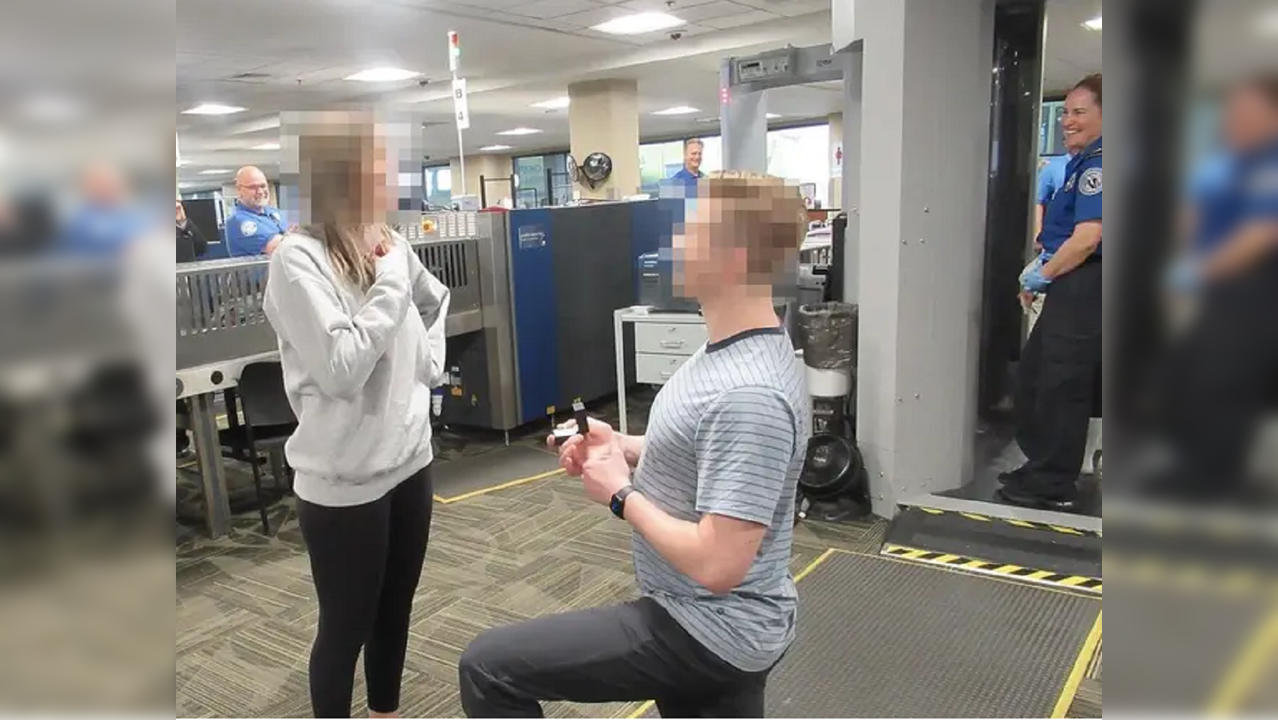 Man pops the question in security check area.