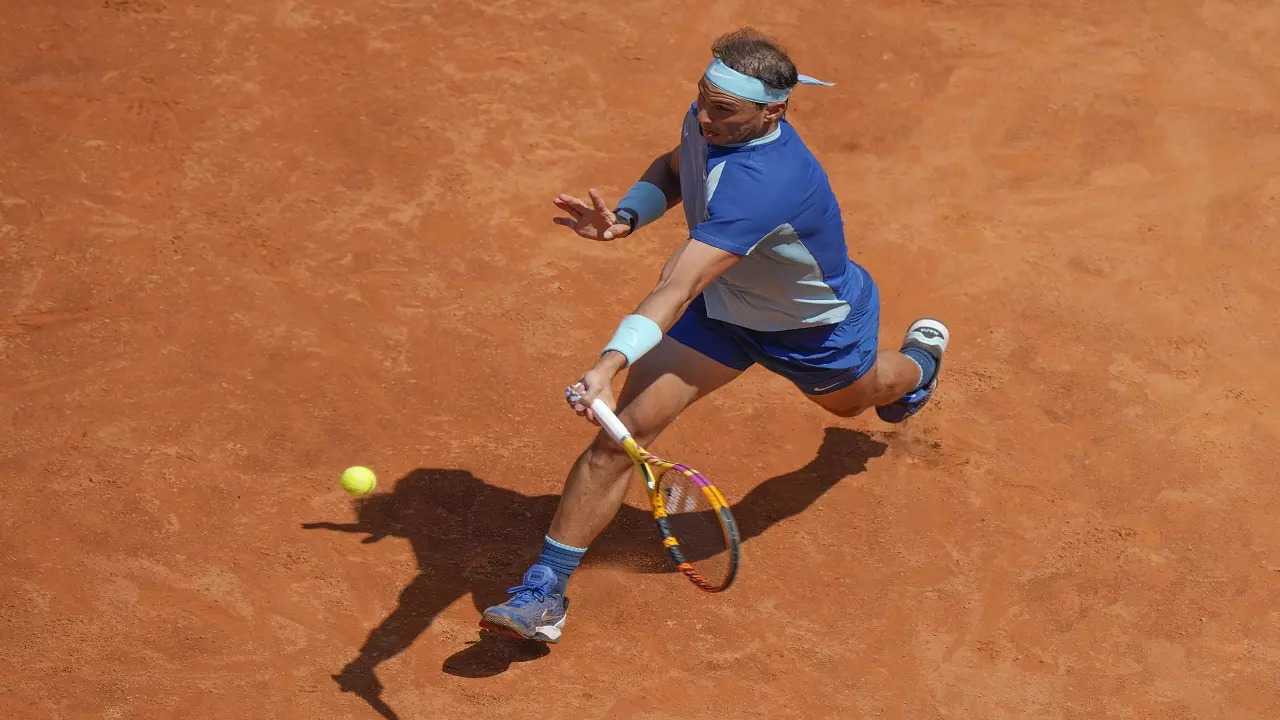 Rafael Nadal eased into the last 16 of the Italian Open on Wednesday with a straightforward 6-3, 6-1 win over John Isner