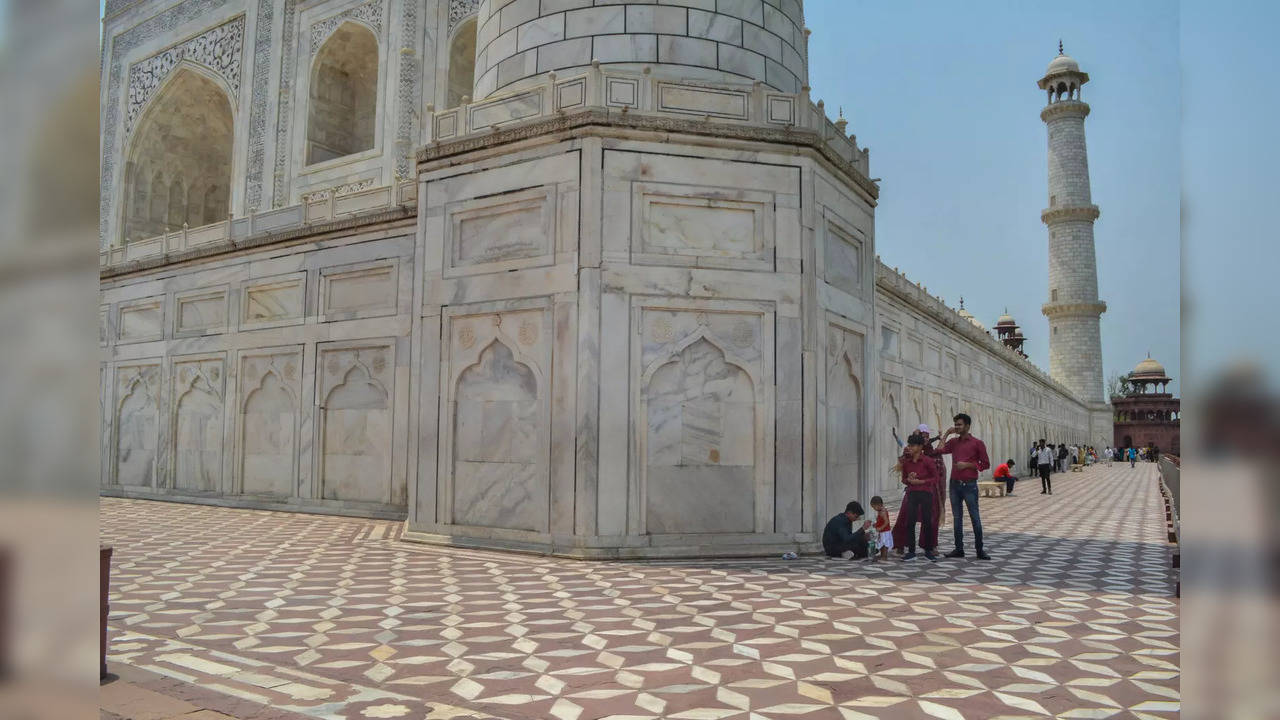 Agra: Tourists visit the Taj Mahal on a hot summer day, in Agra. A petition has ...