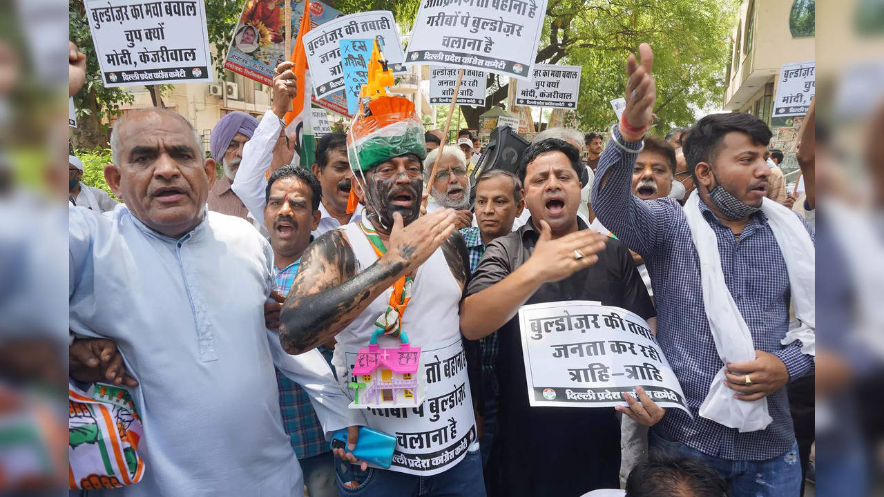 New Delhi: Congress workers protest against the recent demolition drives carried...