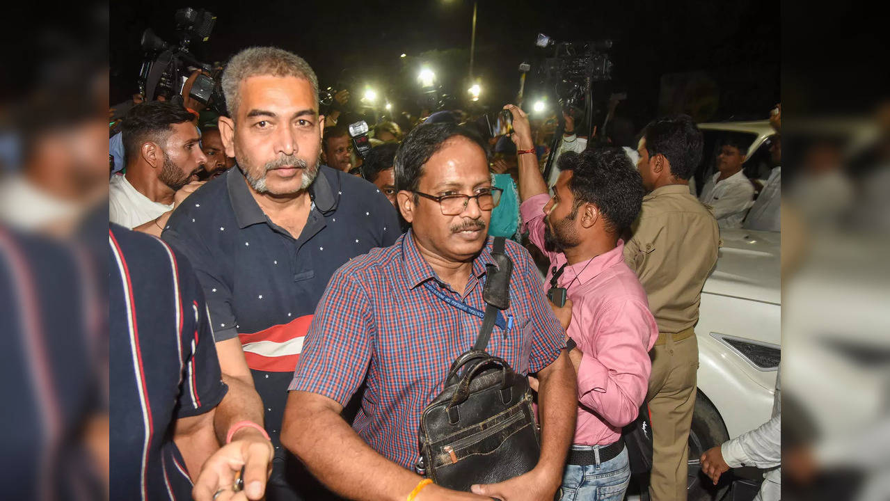 Patna: CBI officers leave the residence of RJD Chief Lalu Prasad under security,...