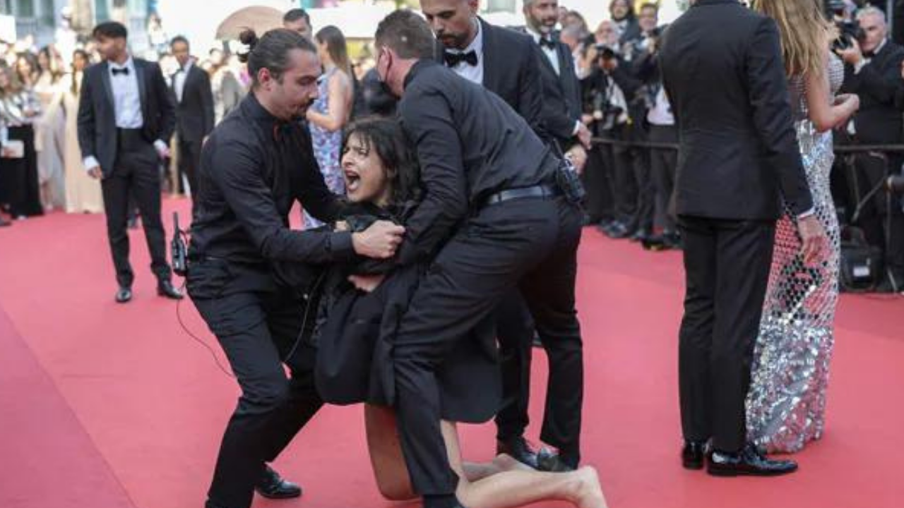 Woman protests on Cannes red carpet