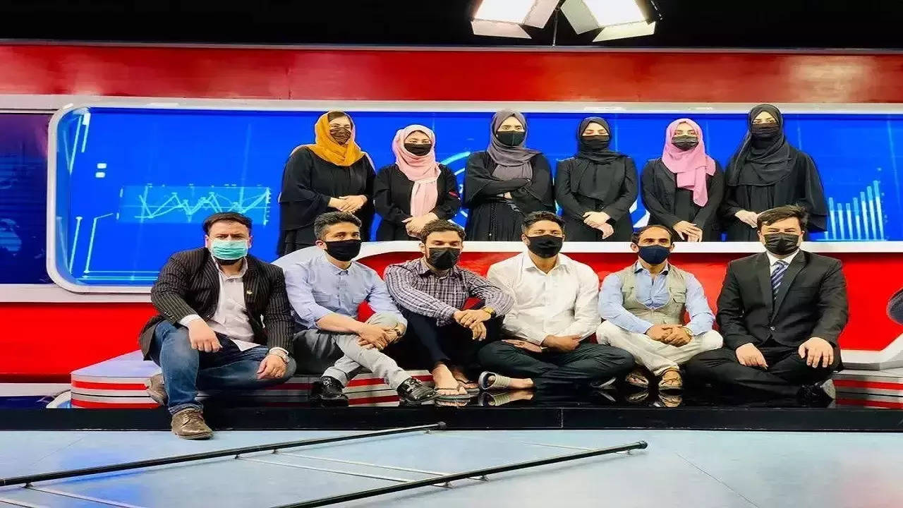 Male news presenters wear masks to show solidarity with women