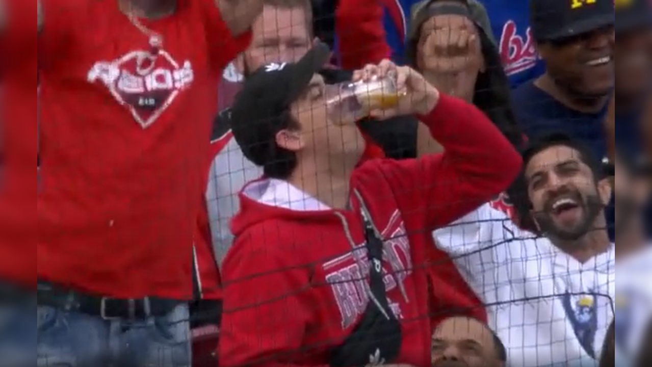 Viral video Man accidentally catches baseball in his beer cup; chugs