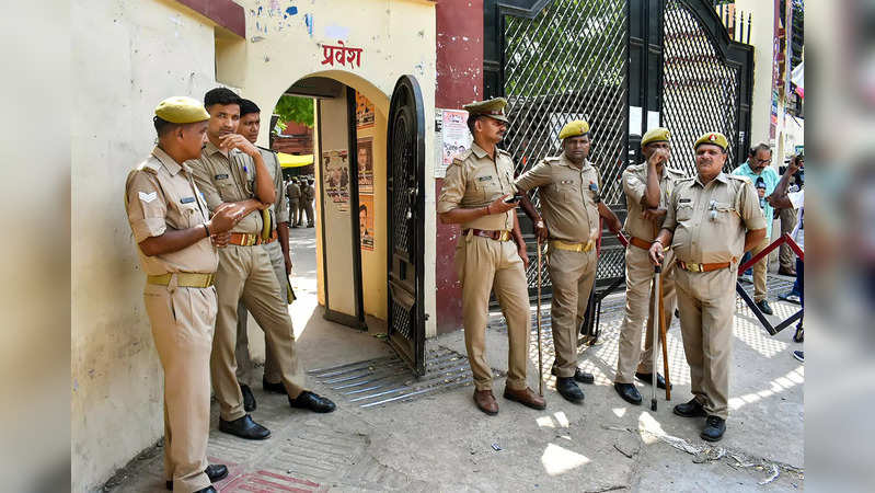 Varanasi: Police personnel stand guard during the hearing of the Gyanvapi Masjid...