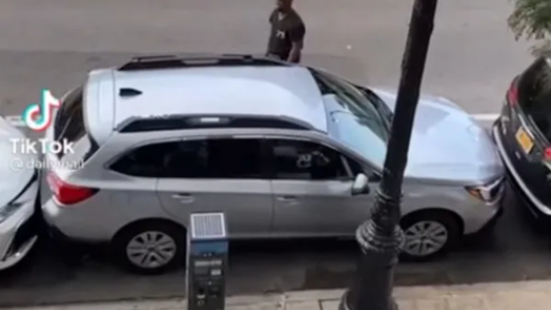 Man pulls out car parked bumper-to-bumper as if it's no big deal