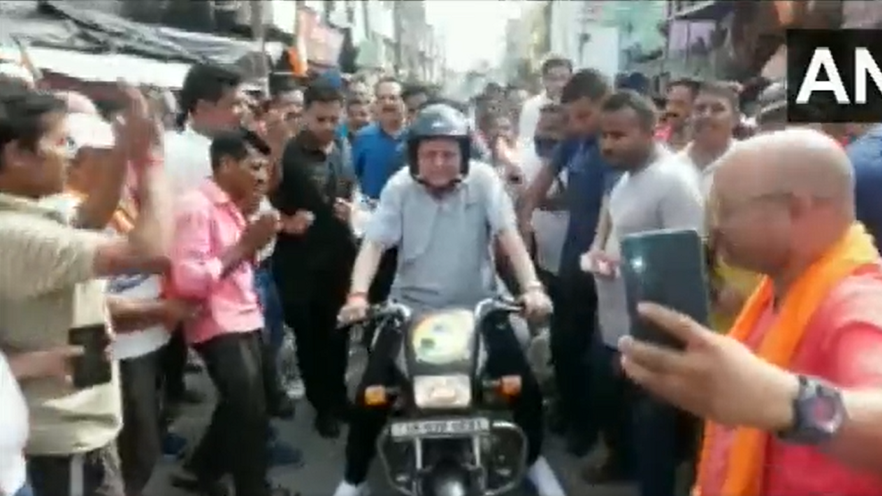 Uttarakhand CM Pushkar Singh Dhami seen riding a bike and urging people to vote in the Champawat by-election