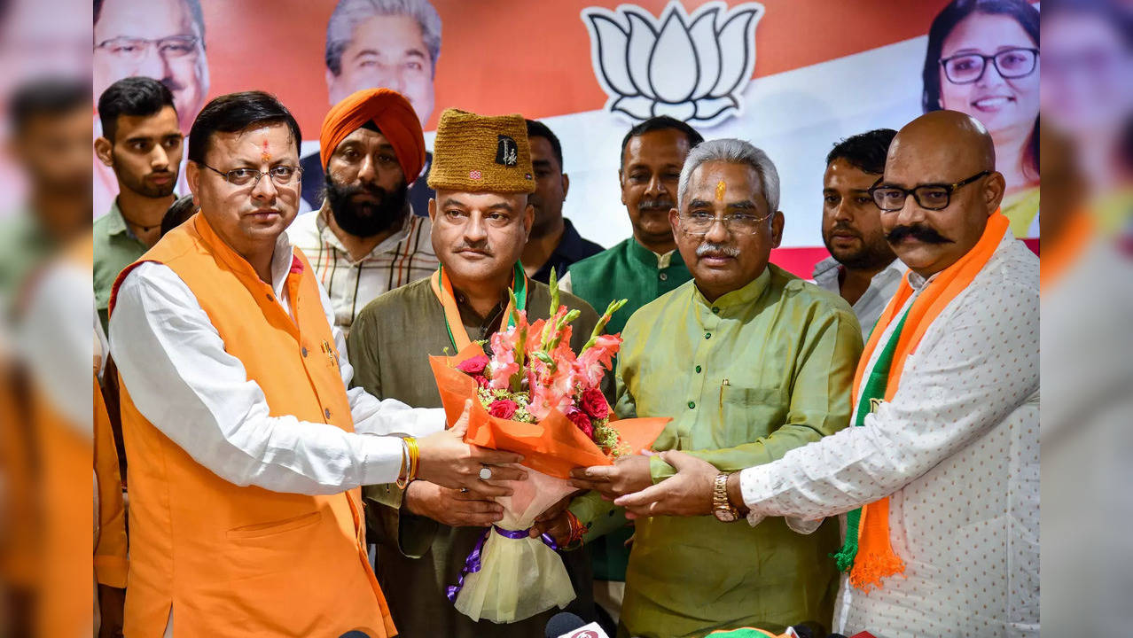 Dehradun: Uttarakhand Chief Minister Pushkar Singh Dhami and State BJP President...