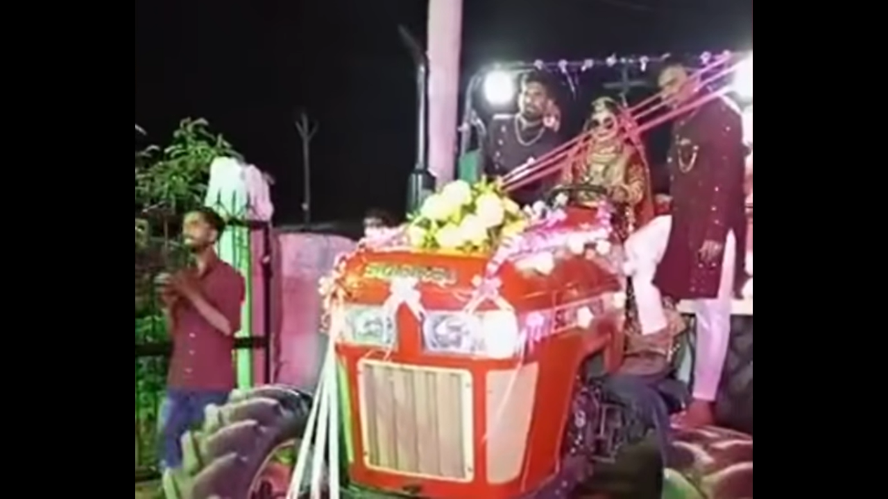 Bride rides a tractor to her wedding venue