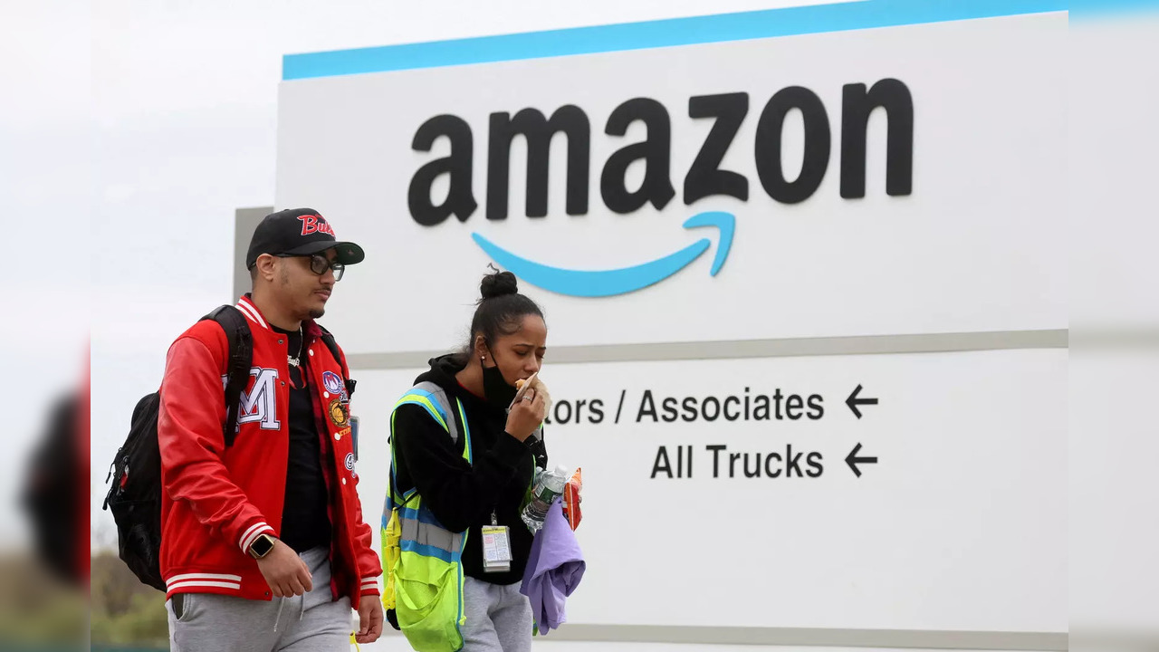 FILE PHOTO: Amazon workers walk outside Amazon’s LDJ5 sortation center in Staten Island, New York