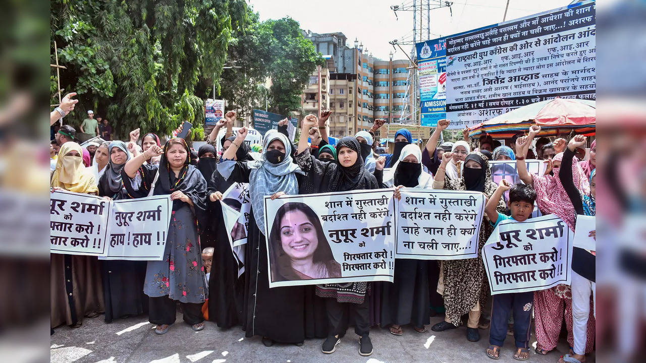 Thane: Women from the Muslim community shout slogans during their protest agains...