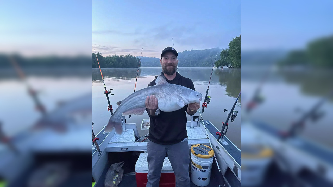 Richard Kesar, pictured with a blue catfish that ate a sex toy | Picture courtesy: Twitter