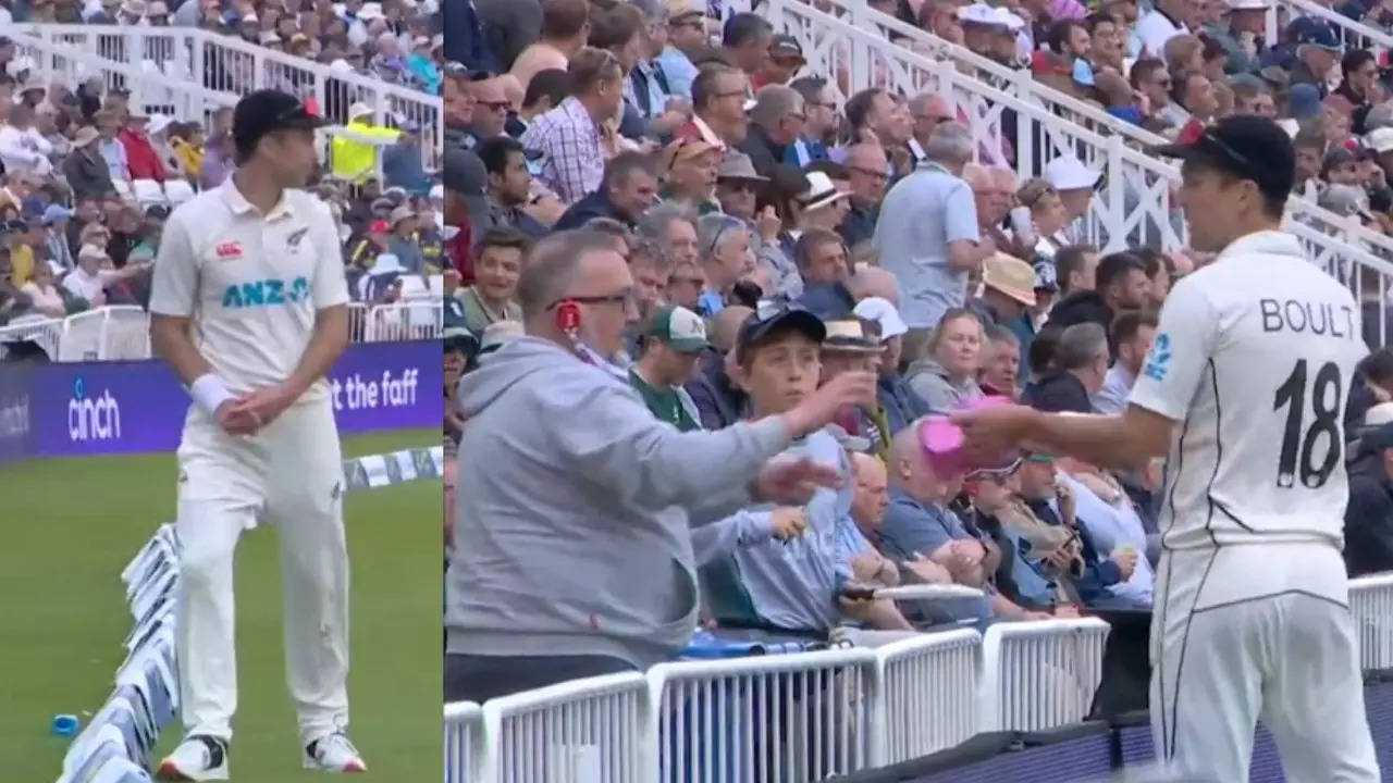 Trent Boult gives an autograph