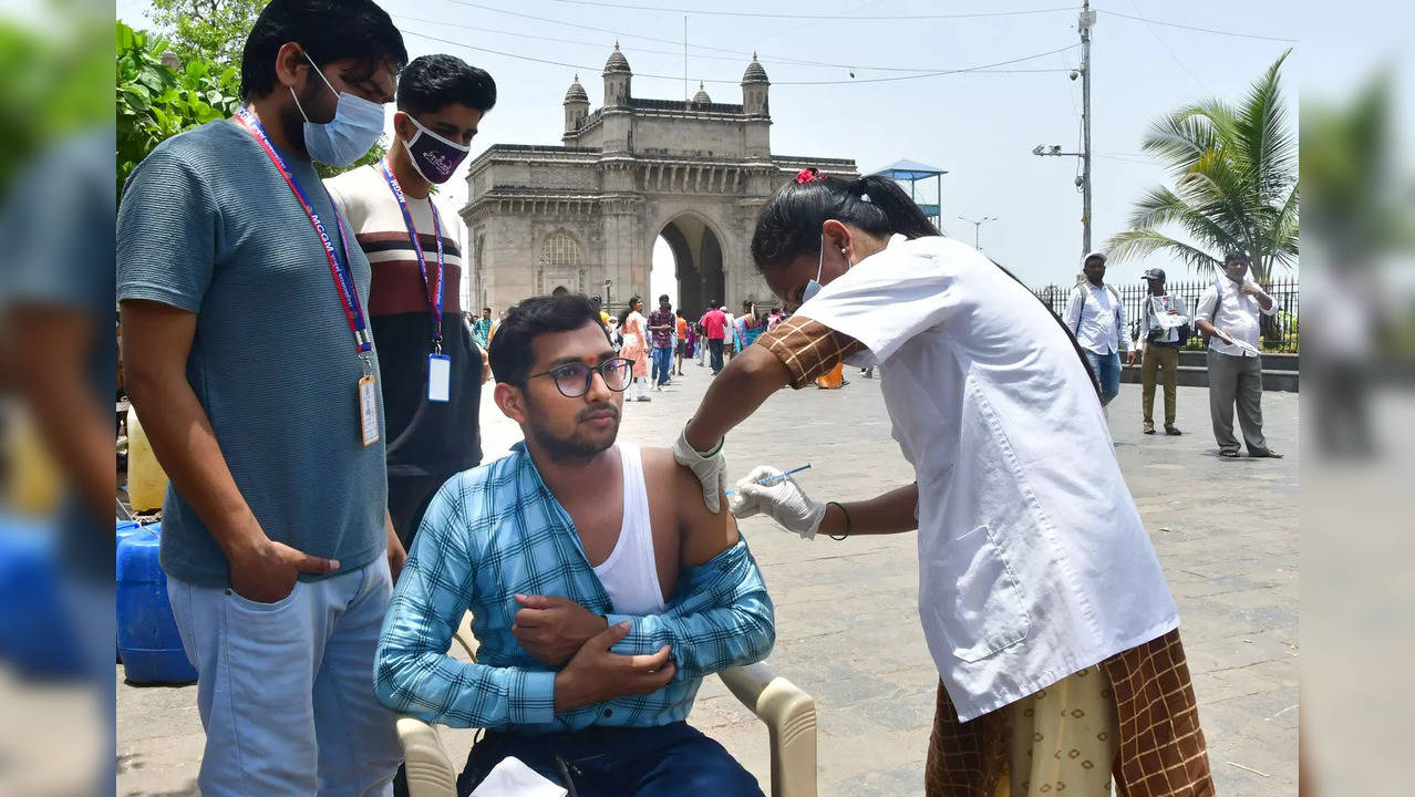 Mumbai: A healthcare worker administers a dose of Covid-19 vaccine to a benefici...