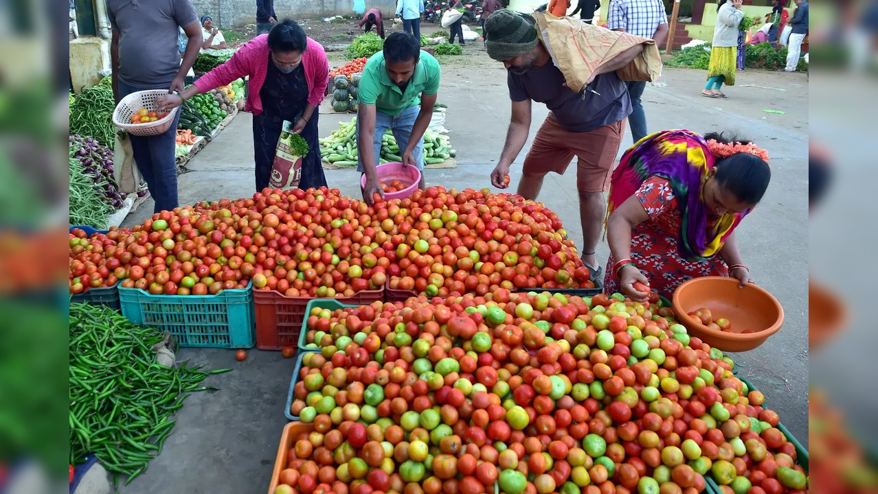 Shivamogga: People buy tomatoes at a wholesale vegetable market after Section 14...