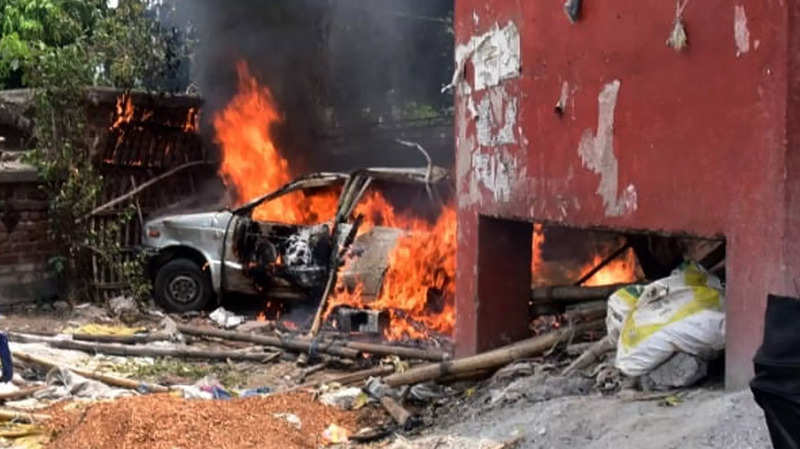 Charred remains of a vehicle after a crowd set on fire Government Railway Police Station during the Bihar Bandh