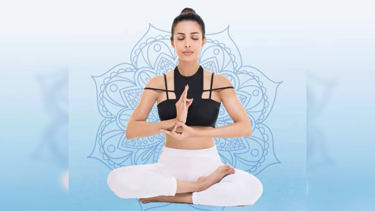 Malaika Arora does this easy yoga asana to stretch sitting muscles - Times  of India