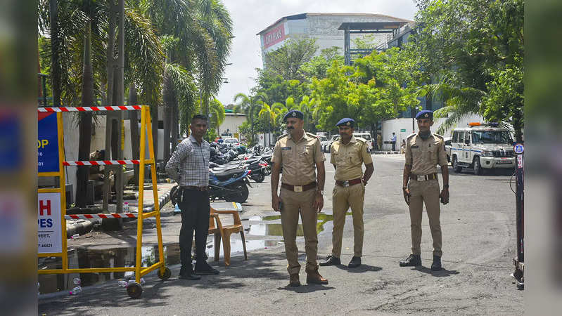 Surat: Police outside a hotel during  meeting of Maharashtra's MPs and MLAs, in ...
