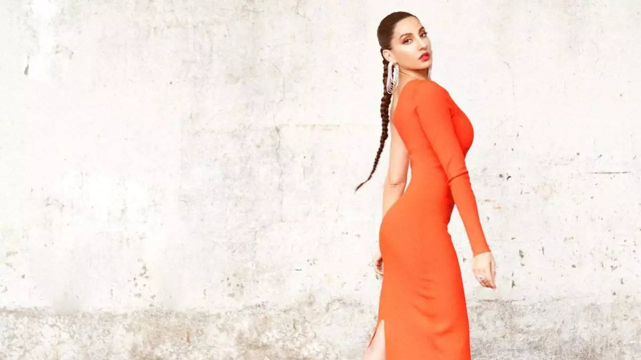 Nora Fatehi Sizzles In Orange Bodycon Dress With Sleek Long Braid Gets Approval From Designer