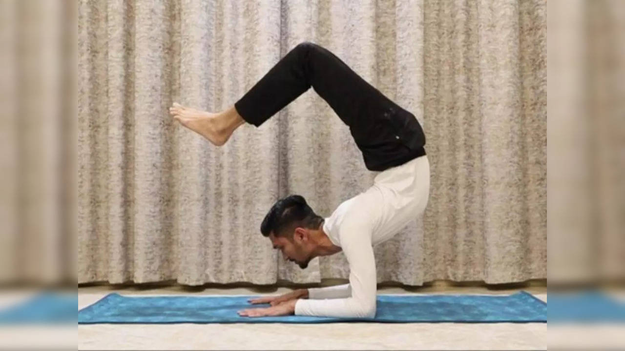 Indian Yoga teacher holds the scorpion position for 29 minutes, 4 seconds, to break a Guinness World Record | Picture courtesy: GWR