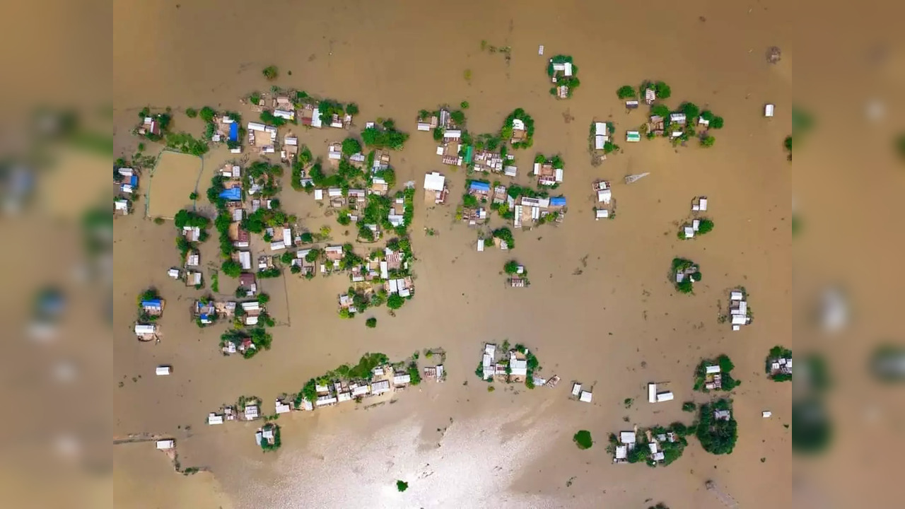 Assam, June 20 (ANI): An aerial view of the flood-affected areas of Assam follow...