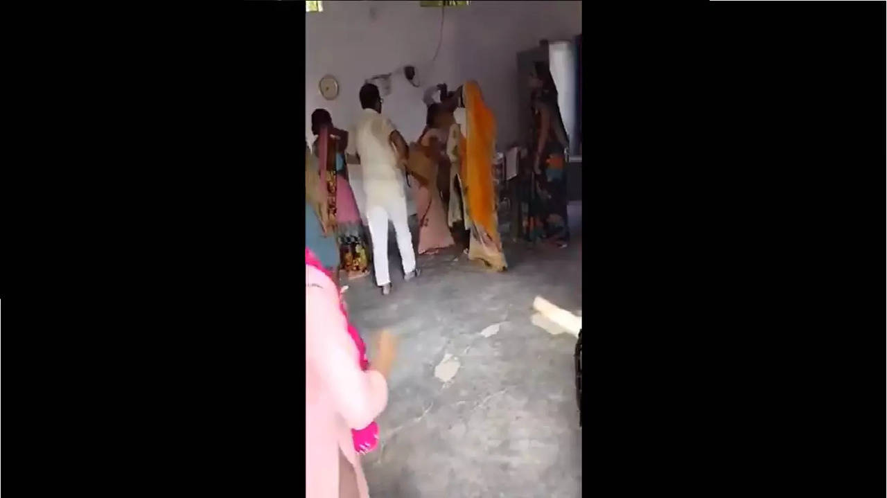 Principal beating woman teacher in Lakhimpur Kheri (video grab)