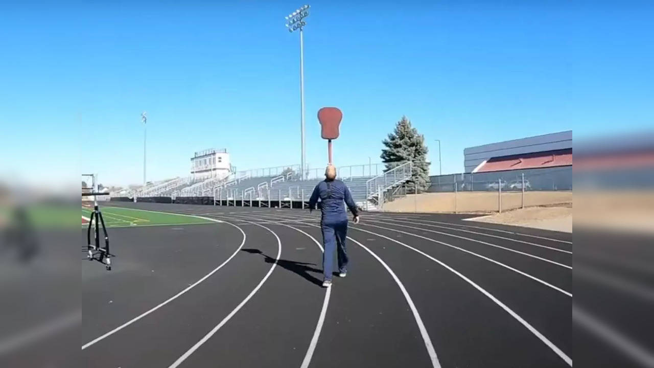 Idaho's David Rush walked 5.4 km balancing a guitar on his chin to break a Guinness World Record and promote STEM education | Picture courtesy: Youtube