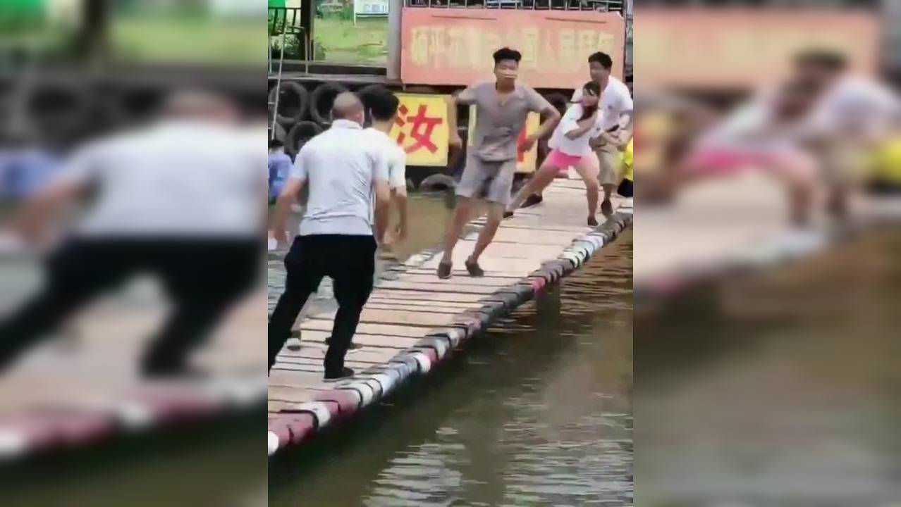 Viral video: People try to shake opponents off a swinging bridge in ...