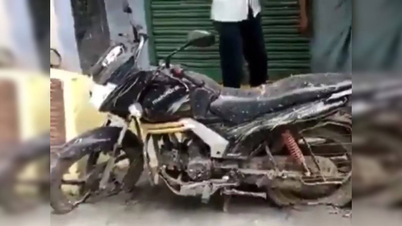 A bike was stuck in a cement road laid without permission by a contractor for Vellore City Municipal Corporation | Picture: Twitter