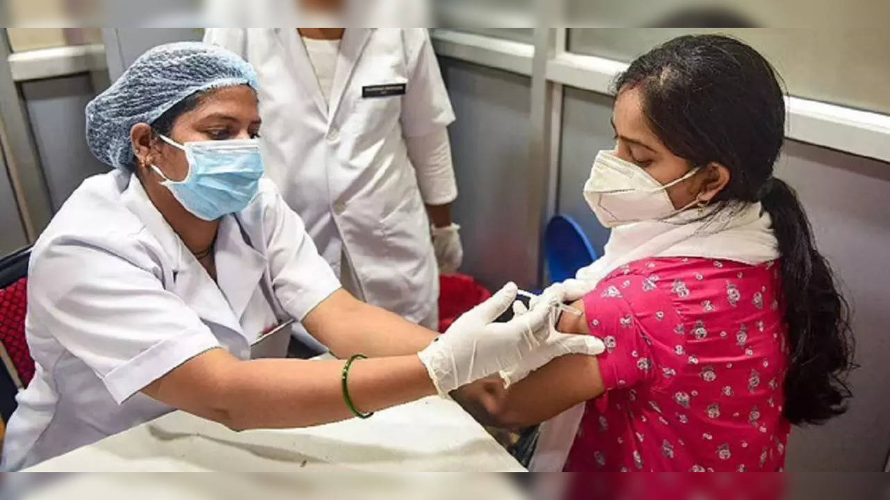 Woman being administered COVID vaccine