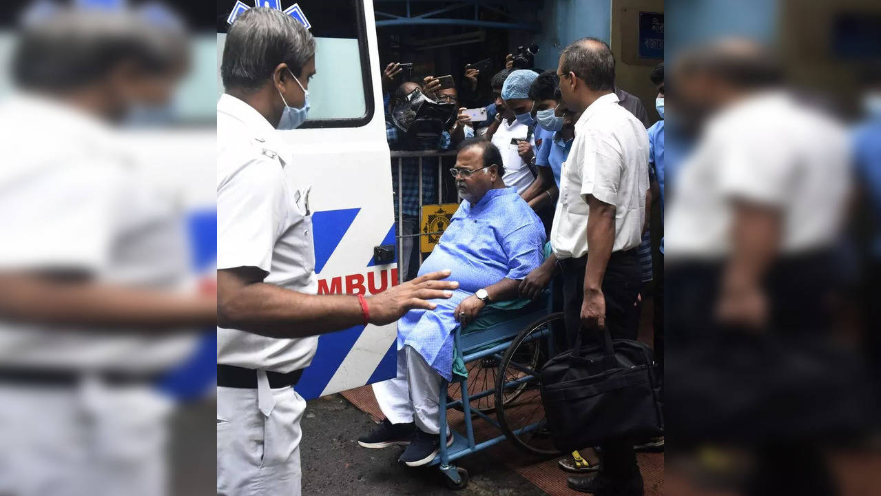 Kolkata: West Bengal Minister Partha Chatterjee (in wheelchair) being shifted to...