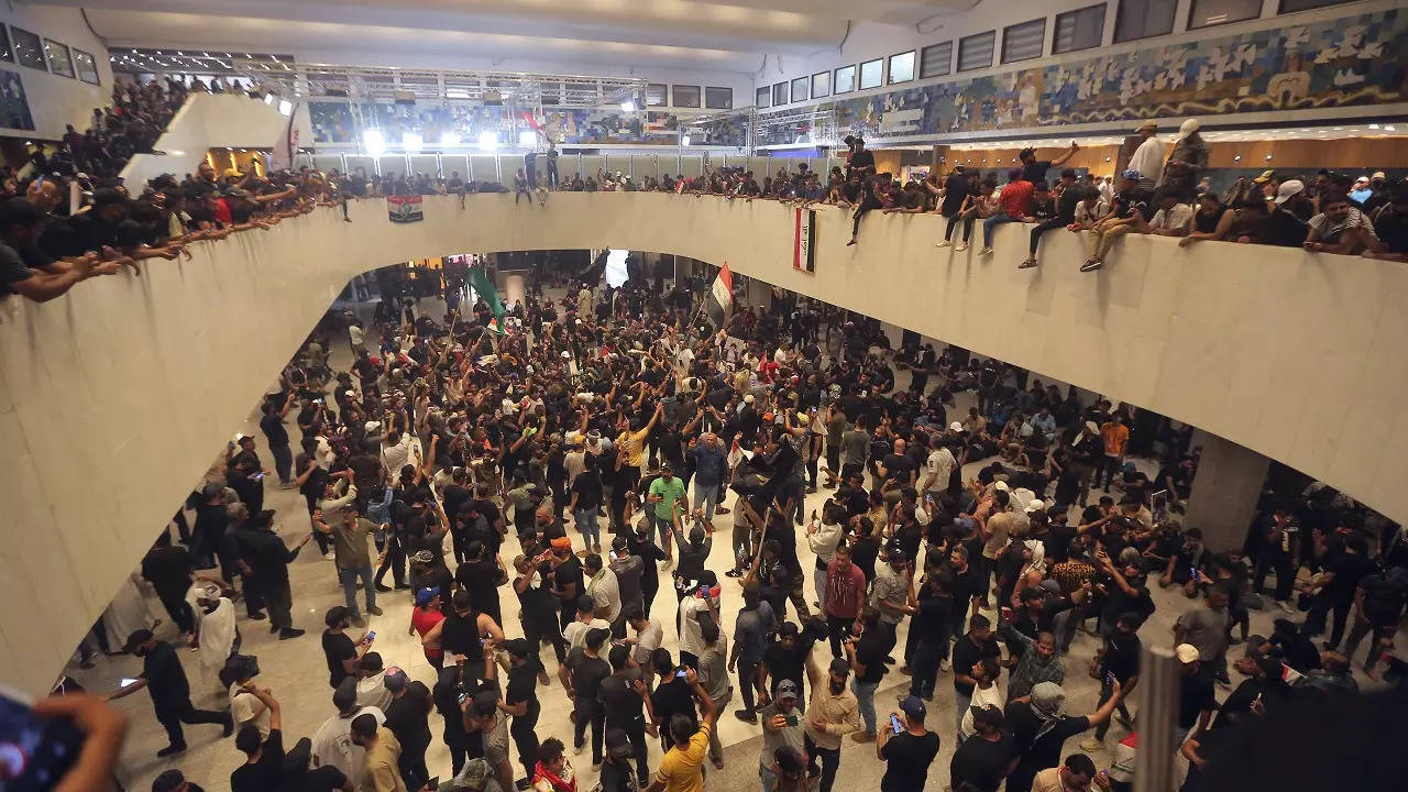 Iraqi protesters fill the Parliament building in Baghdad