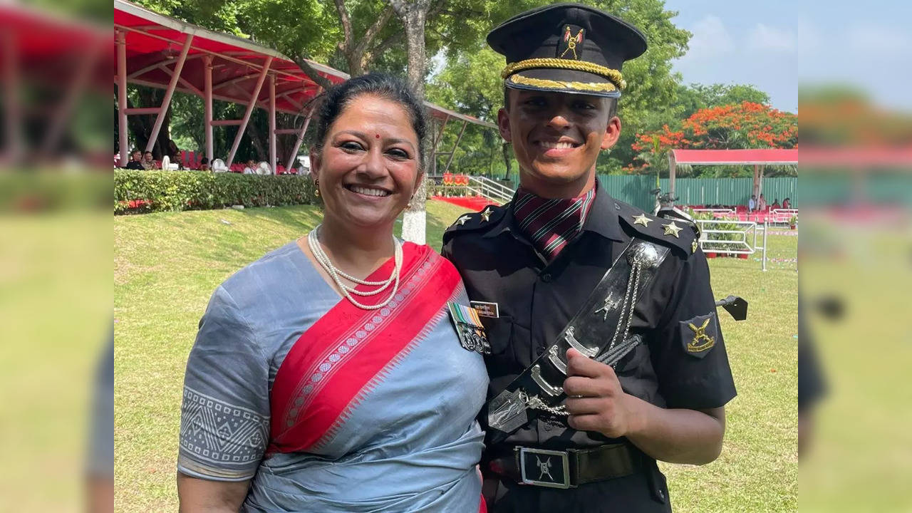 Major Smita Chaturvedi (retired) pictured with her son at the commissioning ceremony at the Officers Training Academy | Picture courtesy: Twitter/@Def_PRO_Chennai