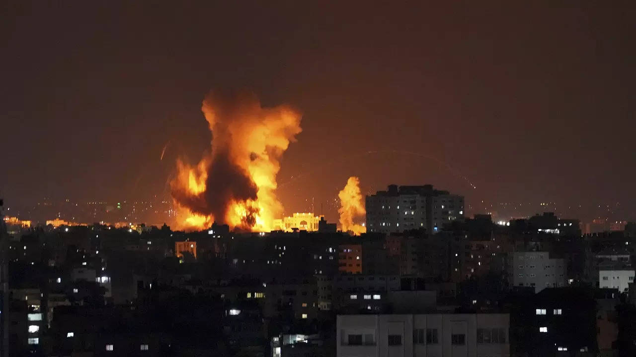 Smoke rises following Israeli airstrikes on a building in Gaza City