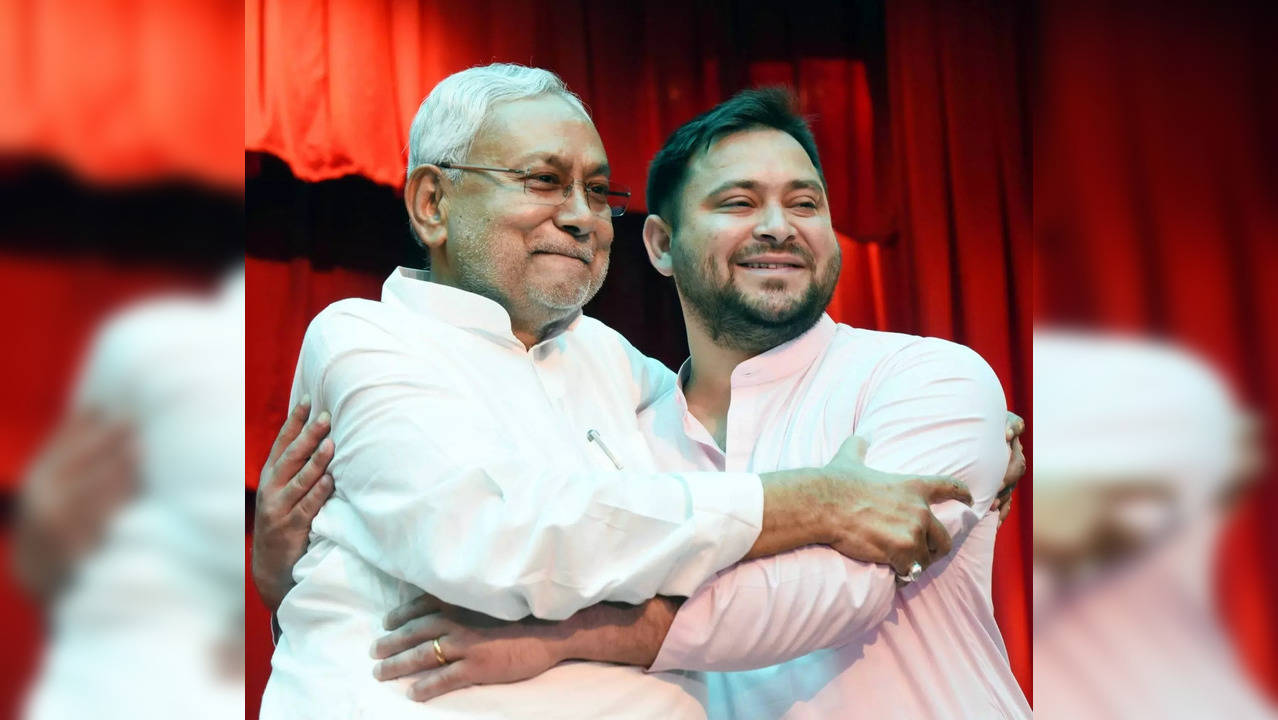 Patna:Bihar Chief Minister Nitish Kumar being greeted by Rashtriya Janata Dal(RJD)leader and Deputy Chief Minister Tejashwi Yadav after taking oath at Raj Bhavan in Patna on Wednesday August 10,2022.(Photo: AFTAB ALAM SIDDIQUI/IANS)