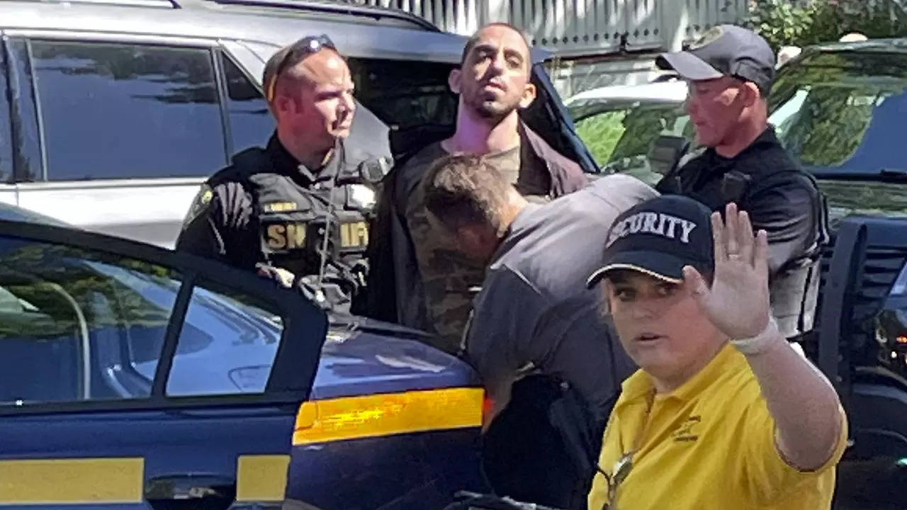 ​Law enforcement officers detain Hadi Matar outside the Chautauqua Institution​